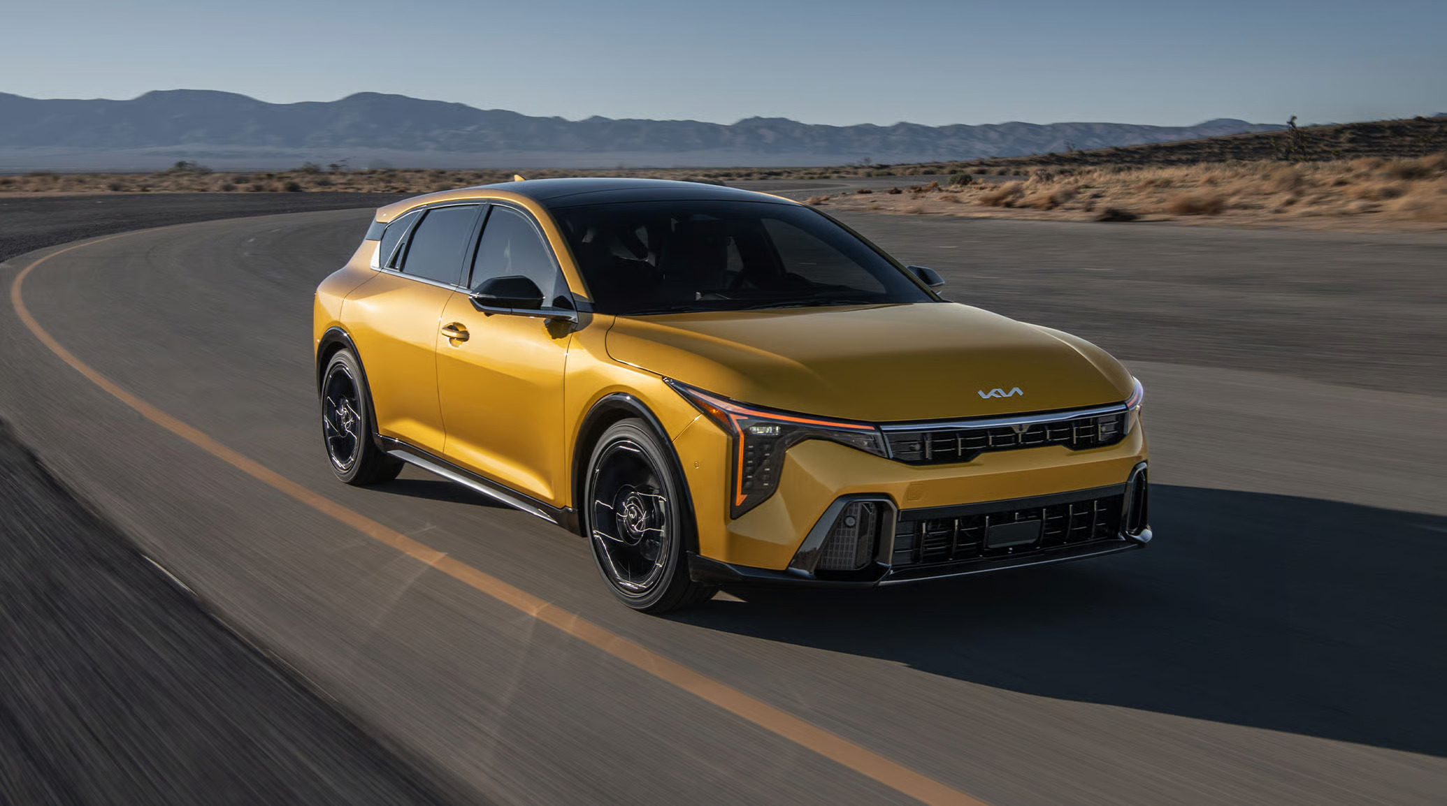 Photo of a Yellow 2026 Kia K4 on the road